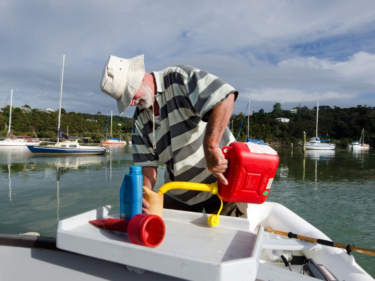 Man filling up a boat fuel tank