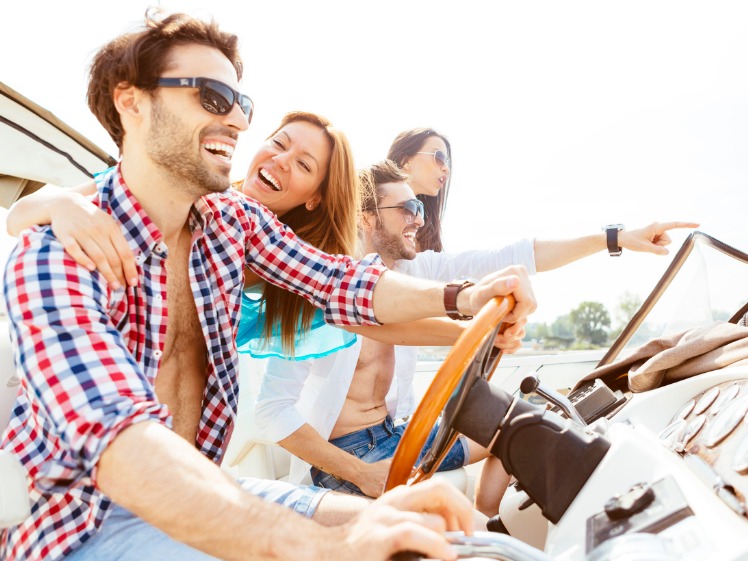 Young couple enjoying a hot summers day out on their boat